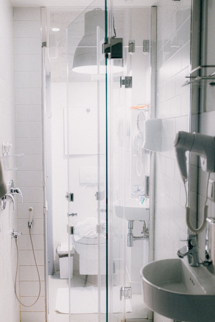 Stylish contemporary bathroom featuring a clean, minimalist design with a glass shower enclosure.
